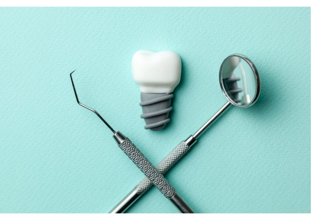 Dental implant model with crown and dental tools on a blue background representing tooth replacement.